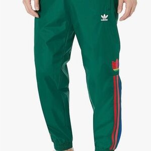 Adidas Men's Green Joggers with Multicolor Stripes